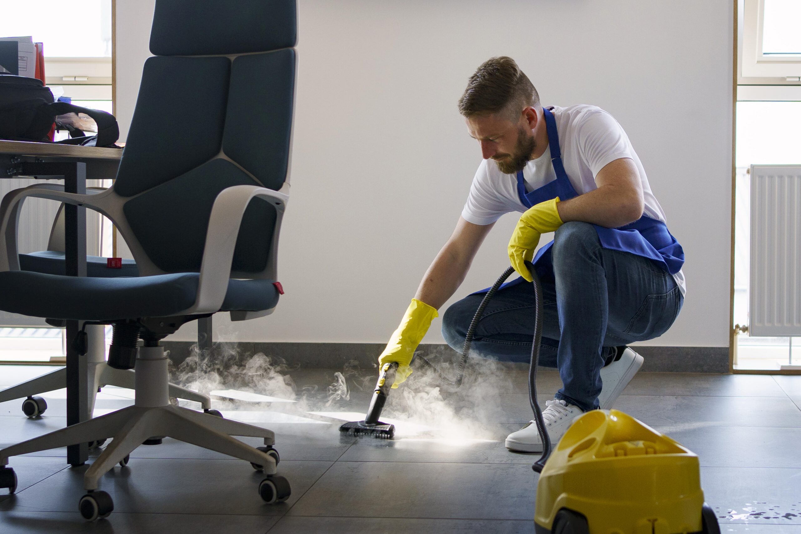 professional-cleaning-service-person-using-steam-cleaner-office-min