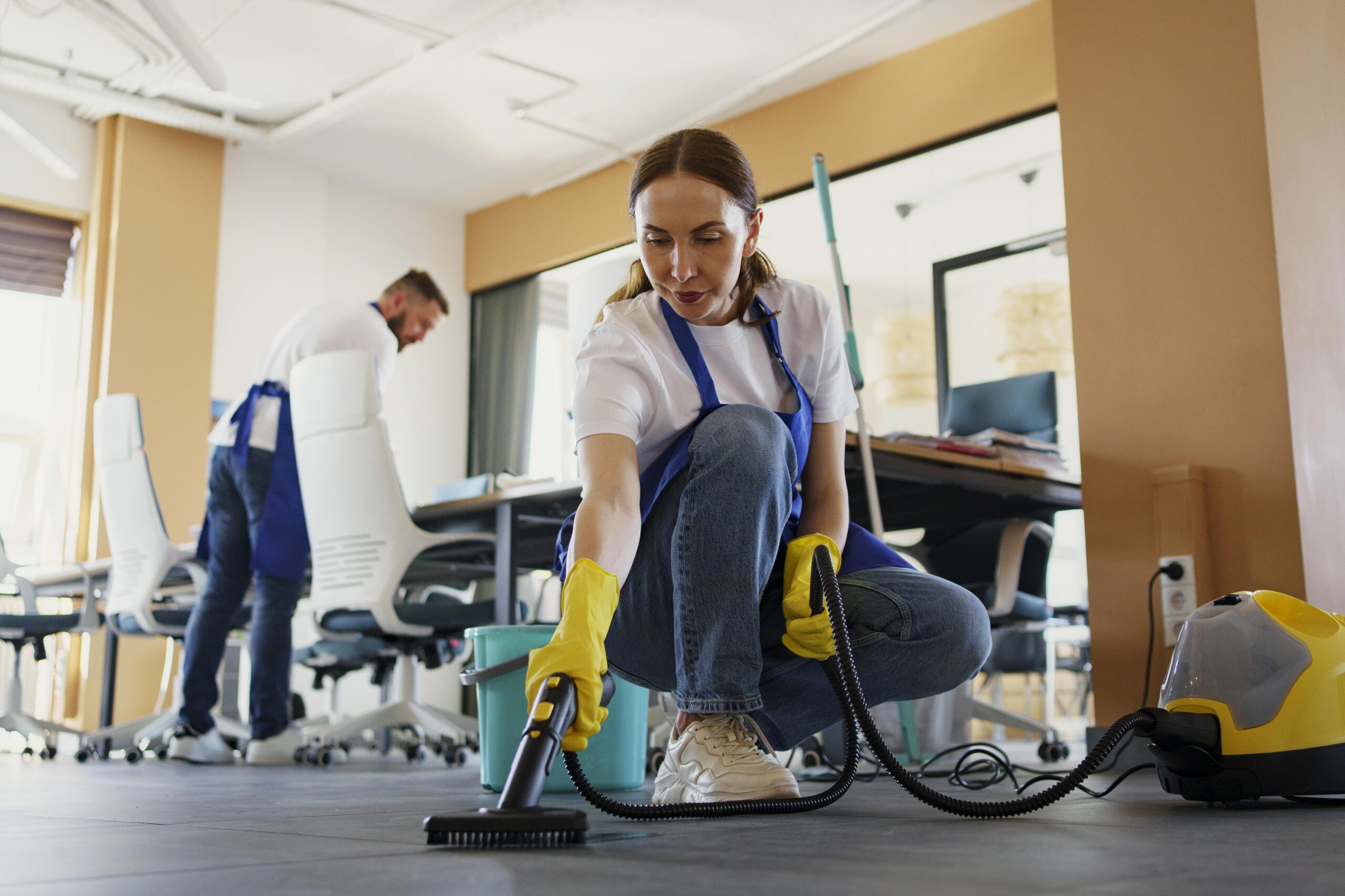 professional-cleaning-service-person-using-vacuum-cleaner-office-min